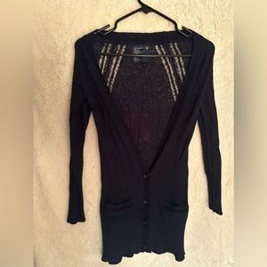 Form fitting thin material sweater. Great look with jeans, a cami and heels.